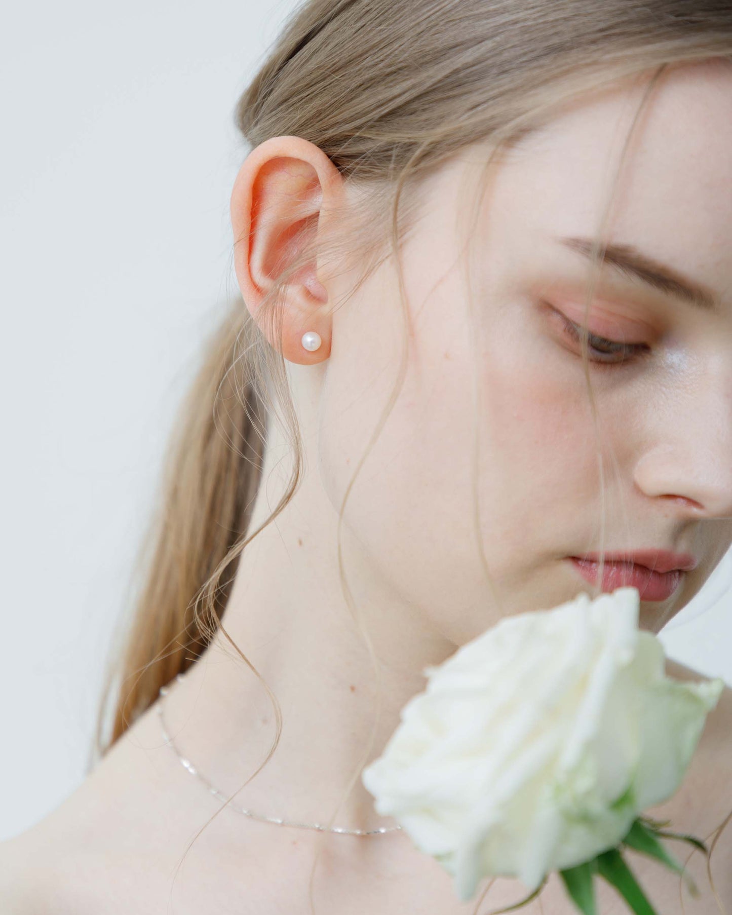 White Round Pearl Pierces